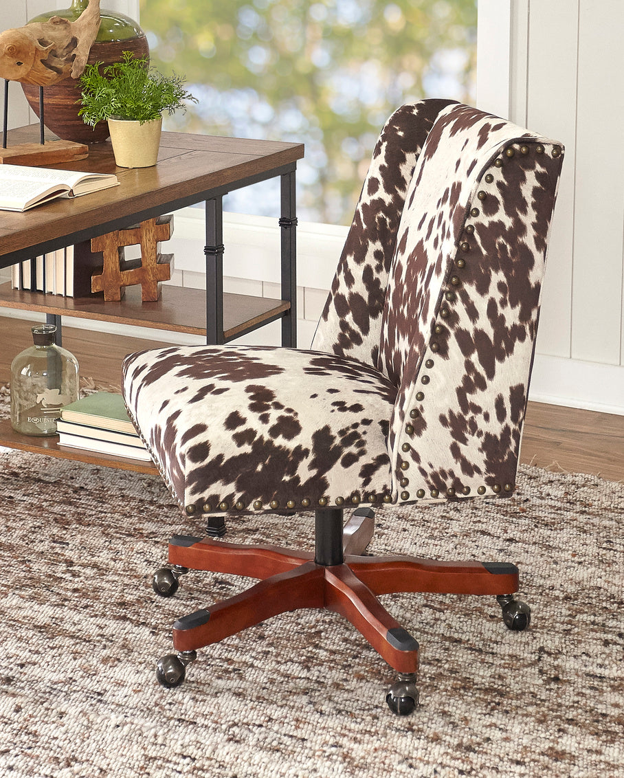 Cow print office chair with outlet arms